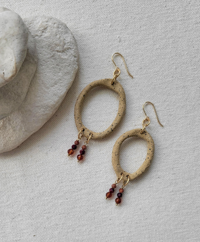 The Lutum Goddess - Asymmetrical Ceramic Garnet Rhodonite Goldstone Gold Hoop Earrings